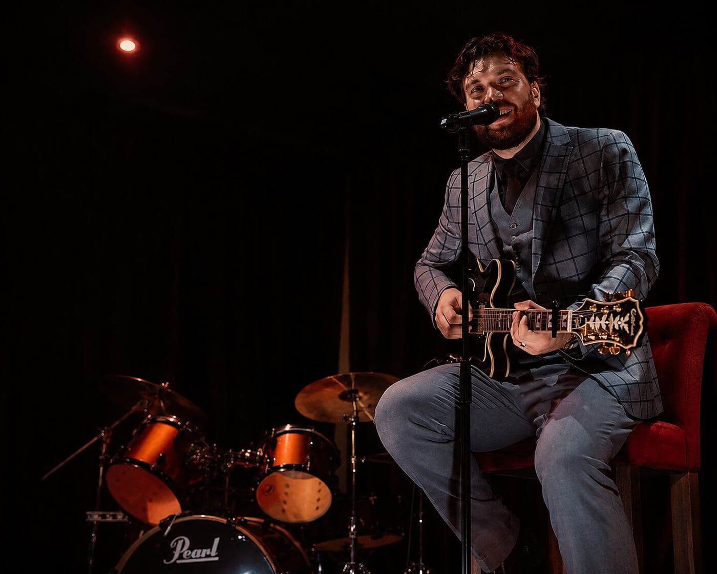 Marcel Gorlami performing live guitar and vocals on stage